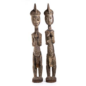 A PAIR OF WOOD, TEXTILE AND BEADS FIGURES ... 