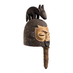 A PAINTED WOOD AND TEXTILE HEMBA HELMET ... 