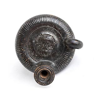 BLACK-GLAZED GUTTUS WITH HERACLES ... 