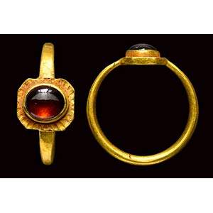 A late roman gold ring with garnet bazel. ... 
