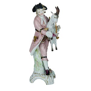 Statuette    Statuette of bagpipe with goat. ... 