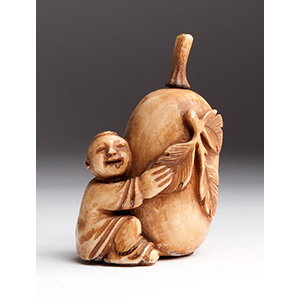 Carved boy with fruit, Ivory nuff bottle; XX ... 