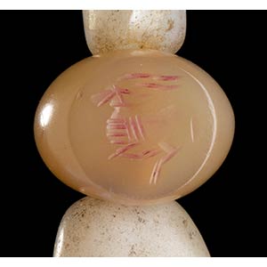 A STONE BEADS, SOME INCISED WITH ... 
