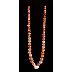 A CARNELIAN AND GLASS BEADS NECKLACE WITH ... 
