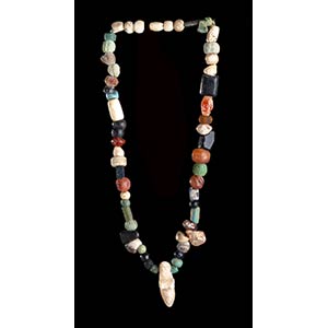 A POTTERY, GLASS, STONE AND CONCHSHELL BEADS ... 