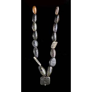 A STONE BEADS NECKLACE WITH INCISED ... 