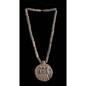 AN INCISED POTTERY BEADS NECKLACE WITH MASK ... 