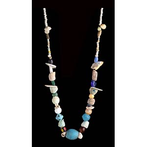 A STONE, GLASS AND CONCHSHELL BEADS ... 