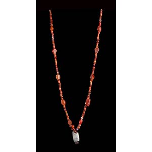 A STONE, CARNELIAN AND GLASS BEADS NECKLACE ... 